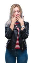 Sticker - Young blonde woman wearing black jacket over isolated background shocked covering mouth with hands for mistake. Secret concept.