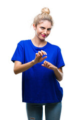 Wall Mural - Young beautiful blonde and blue eyes woman wearing blue t-shirt over isolated background disgusted expression, displeased and fearful doing disgust face because aversion reaction. With hands raised.