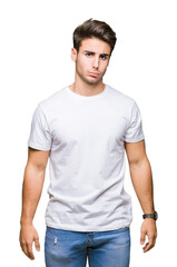 Young handsome man wearing white t-shirt over isolated background depressed and worry for distress, crying angry and afraid. Sad expression.