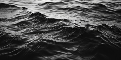 Poster - A black and white photo of a body of water. Can be used as a minimalist background or for artistic projects