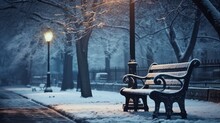 Night View Of Park Bench Under Tree During Winter Snow.