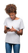 © Krakenimages.com - Young african american woman using smartphone over isolated background scared in shock with a surprise face, afraid and excited with fear expression