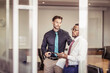 © Stefanie - Office coworkers together in discussion in a meeting room and having a team building workshop