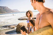 © Stefanie - Mixed race family having fun playing on the beach. Cape Town, South Africa
