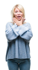 Wall Mural - Young beautiful blonde woman wearing winter sweater over isolated background shouting and suffocate because painful strangle. Health problem. Asphyxiate and suicide concept.