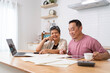 © pixs4u - Happy Asian senior couple use digital technology device to working at home