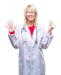 Sticker - Young beautiful blonde doctor woman wearing medical uniform over isolated background showing and pointing up with fingers number nine while smiling confident and happy.