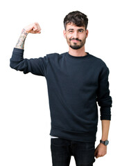 Sticker - Young handsome man over isolated background Strong person showing arm muscle, confident and proud of power