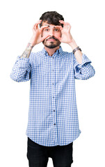 Canvas Print - Young handsome business man over isolated background Trying to open eyes with fingers, sleepy and tired for morning fatigue