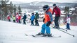 Children learning skiing basics with instructor on gentle slope.