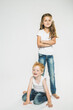 © Stefanie - Portrait of two children in studio with white background.