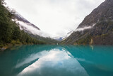 Fototapeta Góry - Turquoise Lake with mountain views