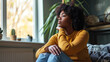 © Sasint - Black woman feeling depression symptoms alone at home