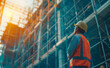 © Curioso.Photography - Engineer Technician Supervises Workers on Steel Platform in Unfinished Construction Project