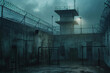 Gloomy prison yard with watchtower under overcast sky