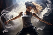 © Anna - Beautiful girl dancing on a dark background in smoke.
