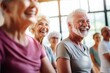 © sambath - Group of seniors engaging in a laughter-filled gymnastics class, highlighting the social benefits of sport and health, sport, health