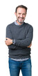 © Krakenimages.com - Handsome middle age senior man wearing a sweater over isolated background happy face smiling with crossed arms looking at the camera. Positive person.