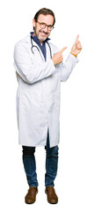 Poster - Handsome middle age doctor man wearing medical coat smiling and looking at the camera pointing with two hands and fingers to the side.