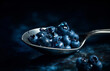 - 1 blueberry in a spoon on a blue tablecloth, generative ai