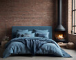 Bed with blue pillows and coverlet near fireplace against white brick wall. Loft, scandinavian interior design