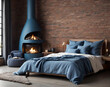 Bed with blue pillows and coverlet near fireplace against white brick wall. Loft, scandinavian interior design