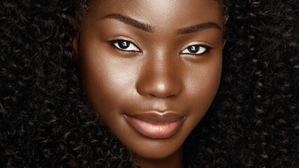 Wall Mural - close up fashion beauty face portrait of young beautiful african american woman with curly afro hair