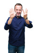 © Krakenimages.com - Middle age hoary senior man over isolated background showing and pointing up with fingers number eight while smiling confident and happy.