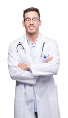 Canvas Print - Handsome young doctor man happy face smiling with crossed arms looking at the camera. Positive person.