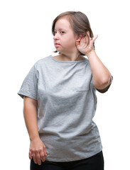 Sticker - Young adult woman with down syndrome over isolated background smiling with hand over ear listening an hearing to rumor or gossip. Deafness concept.