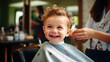 © dinastya - Portrait of cute smiling modern toddler child sitting in barber chair getting first haircut. Barbershop for children, beauty salon.