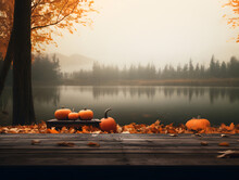 A Rustic Autumn Landscape, With Vibrant Orange Pumpkins Resting On A Wooden Dock By The Calm Lake, Surrounded By Lush Trees And A Clear Blue Sky