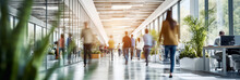 Businesspeople Walking At Modern Office. Concept Work Process. Business Workplace With People In Walking In Blurred Motion In Modern Office Space.
