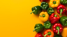 A Group Of Bell Peppers On A Yellow Background