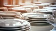 Closeup clean plates stack on a table ready for use