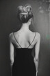Black and white back view of woman in night dress