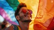 © DELstudio - Generative AI, gay man smiling with rainbow flag, LGBT people walking in the street during the gaypride pride
