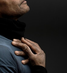 man praying to god Caribbean man praying with black grey background with people stock photo	