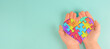 ASD autism spectrum disorder, deficits in social communication and interaction, hands holding heart with colorful jigsaw or puzzle pieces