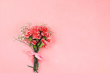 Floral Arrangement With Carnations On A Pink Background. Concept For Valentine's Day Or Women's Day, Mother's Day, Banner, Greeting Your Loved One On Holiday, Birthday,