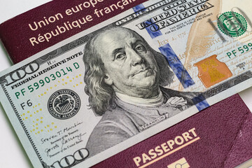 Wall Mural - Closeup view of french passport and us dollar banknotes.