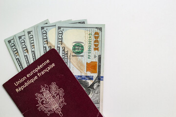 Wall Mural - Closeup view of french passport and us dollar banknotes.