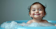 Baby infant taking bath, looking upwards and playing