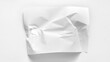 A slightly crumpled sheet of paper close-up with copy space. A white sheet of paper is slightly wrinkled and lies on a white background. Mockup for inscriptions, words, graphics.