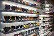 © Elena_Alex - Display rack full of sunglasses. Fashionable sunglasses on the shop shelf