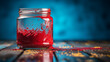 Jar of red paint on a blue table