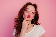 Photo Of A Pretty Brunette Girl With Make Up, Pink Lipstick, On A Pink Background