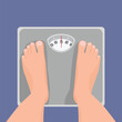 © Tenstudio - Top view of male feet standing on weighing scale