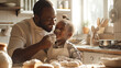 African family cooking baking cake or cookie in the kitchen together, Happy smiling Black son enjoys playing and touching his father nose with finger and flour while doing bakery at home. BeHealthy