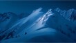 Rugged snowy mountain peaks bathed in a pale blue light, enveloped in cold air and silence.
